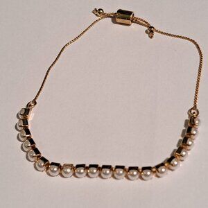 Gold tone and pearl like beaded bracelet